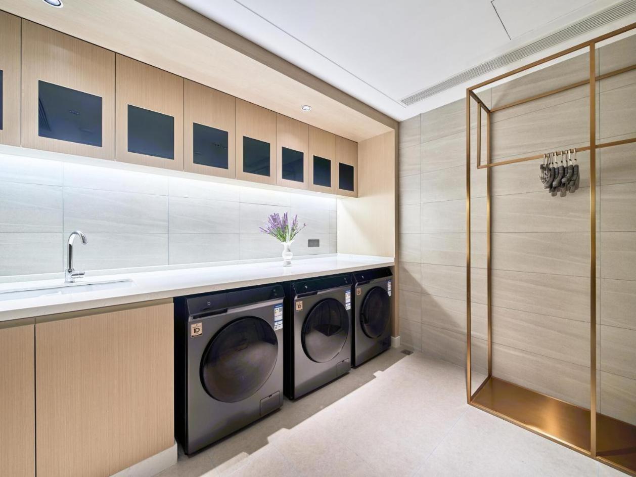 East Sacred Hotel: Tiananmen Square Proximity with Tourism Services Beijing Exterior photo Laundry room