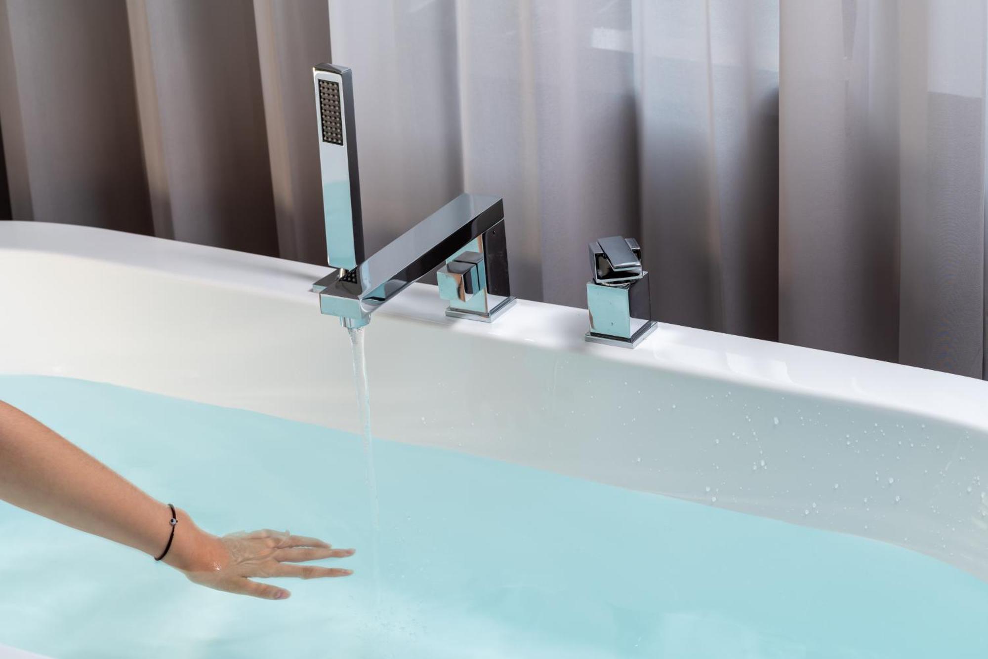 East Sacred Hotel: Tiananmen Square Proximity with Tourism Services Beijing Exterior photo A modern bathtub faucet